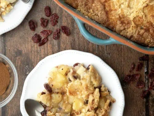 Apple Cranberry Dump Cake in a baking dish and on a plate.